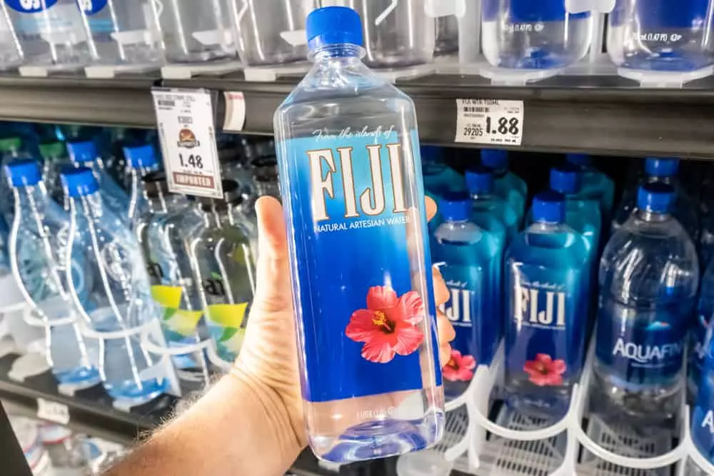 Fiji Water produces new cup holder-friendly bottle size - FoodBev Media